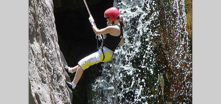 Embrace your adventurous side rappelling next to a waterfall in Mendoza
