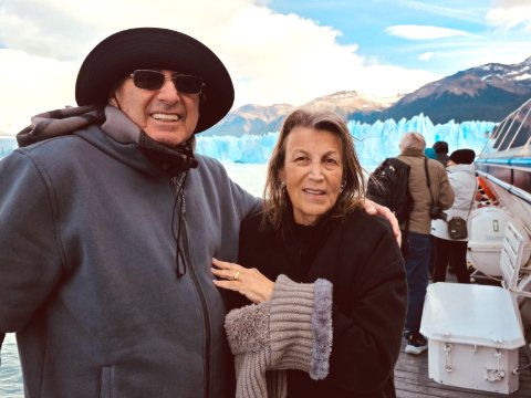 Freddy and Meryl cruise past Perito Moreno Glacier's towering walls