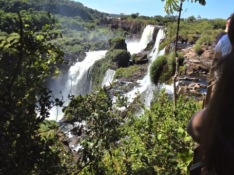 Cascading waterfalls pour through Iguazu Falls' lush jungle